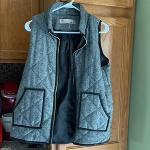 Gray and black herringbone patterned vest